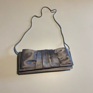 Silver Clutch with Strap Included.